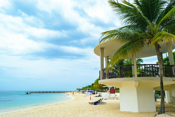 Tropical island beach scene. Relaxing Caribbean summer vacation.