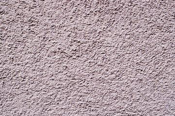 light-pink painted relief wall. background, texture.