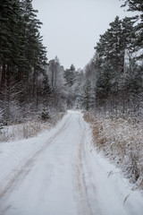Fototapeta premium snowy winter road covered in ice and snow