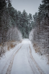Fototapeta premium snowy winter road covered in ice and snow