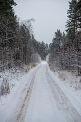 snowy winter road covered in ice and snow