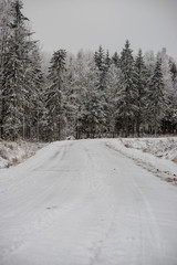 snowy winter road covered in ice and snow