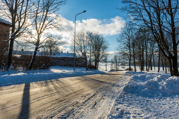 snowy winter road covered in ice and snow