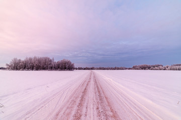 snowy winter road covered in ice and snow