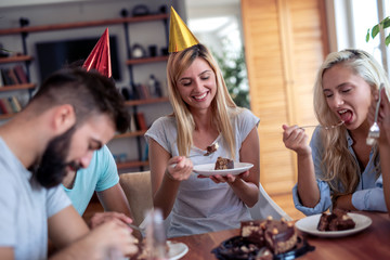 Group of friends enjoying party at home