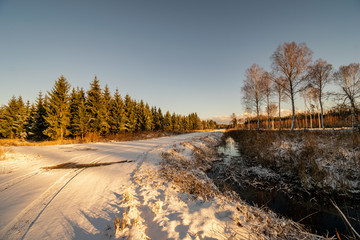 snowy winter road covered in ice and snow