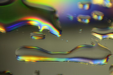abstract colorful background with holographic liquid splash and droplets
