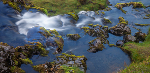 Stones and water. Waterfall in Western Iceland