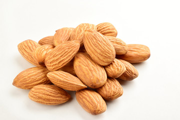 Closeup of almonds, isolated on the white background.