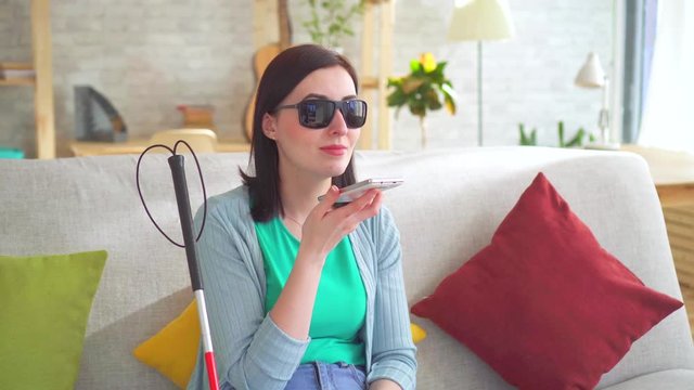 Portrait Young Visually Impaired Woman Talking On The Phone