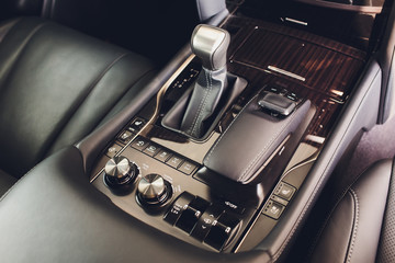 Obraz na płótnie Canvas Detail of modern car interior, gear stick, automatic transmission in expensive car.