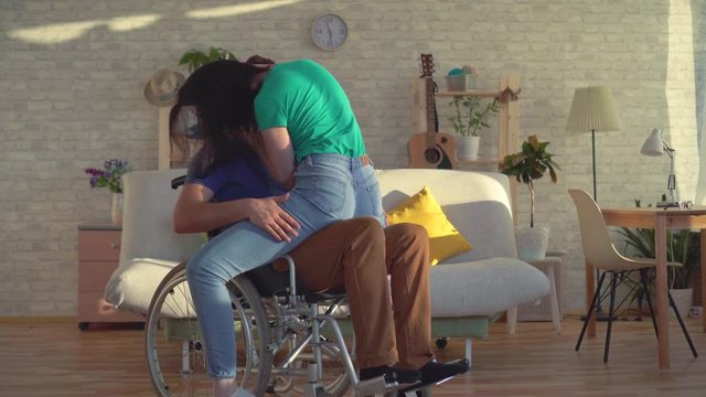 Romantic relationship between a young girl and a disabled person in a wheelchair