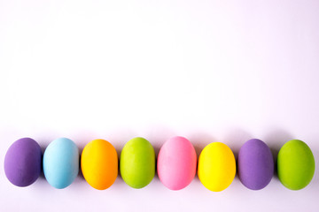 Happy Easter. Easter eggs concept. Row Easter eggs on white paper background.