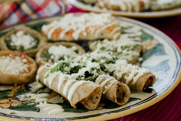 tacos dorados, flautas de pollo, chicken tacos and spicy Salsa Homemade Mexican food in mexico