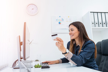 Young woman entering data for internet shopping