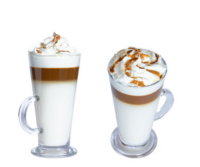Coffee latte macchiato, whipped cream, cinnamon, glass mug. The photo. Isolate on white background.