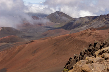 Fototapeta premium View into Haleakala crater with clouds rolling in