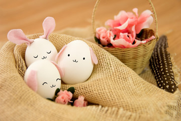 Easter decoration idea with cute eggs and flowers. Selective focus.