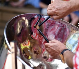Caribbean Steel pan drum player with sticks