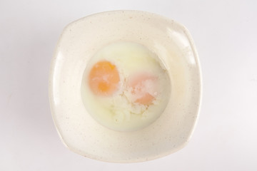 Half boiled egg isolated on white.