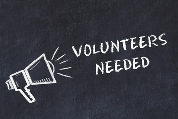 Chalk board sketch with loudspeaker and phrase volunteers needed