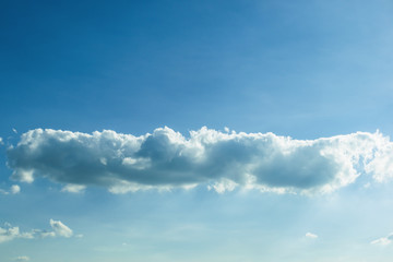 Fototapeta premium fluffy cloud above clear blue sky