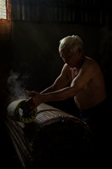 Thai men of Vietnamese descent making drying Vietnamese Rice Paper,Nongkhai,Thailand.