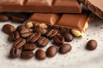 Coffee beans and dark chocolate glaze on the plate