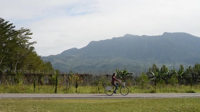 Woman ride a bicycle