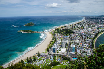 View of the coastline from the top of Mount Manganui with blue sky above, Tauranga, North Island,...