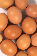 Raw orange eggs lie group. Pattern background random. top view.