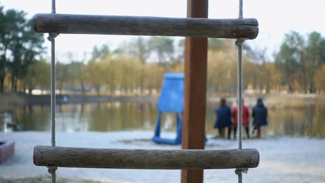 Rope swing in the park. Slow motion 240fps
