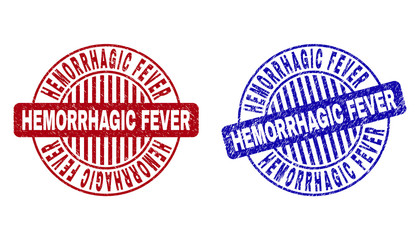 Grunge HEMORRHAGIC FEVER round stamp seals isolated on a white background. Round seals with distress texture in red and blue colors.