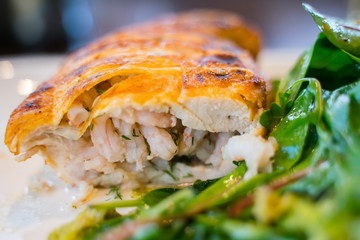 Baked chicken fillet stuffed with shrimps with vegetable salad.