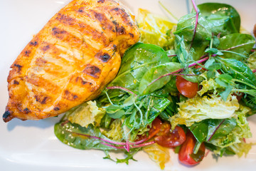 Baked chicken fillet stuffed with shrimps with vegetable salad.