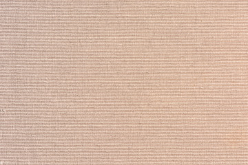 Dense beige upholstery fabric close up. Abstract blank background for layouts. Light photo.