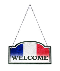 France welcomes you! Old metal sign isolated