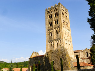 An old tower made of stone in front of the blue sky
