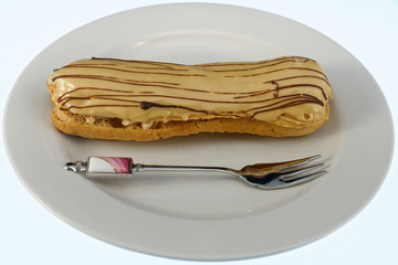 A tasty cream eclair just waiting to be enjoyed