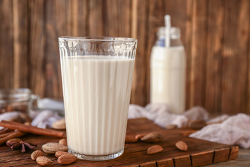 Glass of healthy almond milk on table