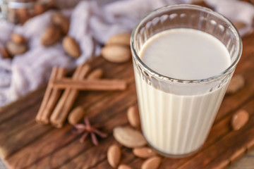 Glass of healthy almond milk on table