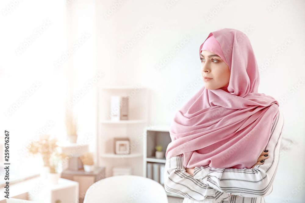 Wall mural portrait of muslim woman in office