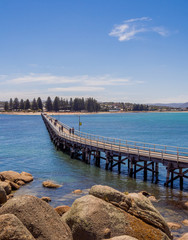 Old wooden bridge connecting Victor Harbour to Granite Island, South Australia.