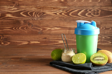 Bottle of protein shake on wooden table