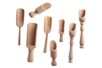 Wooden scoops on white background