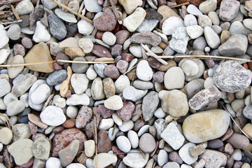 Lot of pebble on the beach background