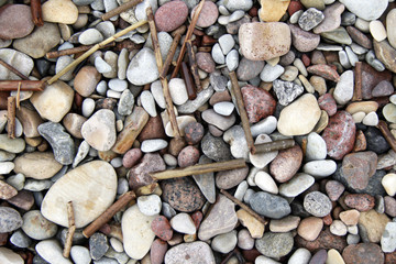 Lot of pebble on the beach background