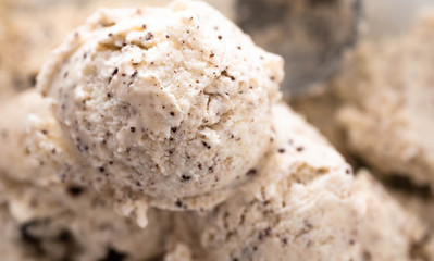 Speciality Italian stracciatella ice cream scoop with flakes of dark chocolate in a creamy vanilla ice-cream viewed from above showing the texture