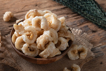 Pork rinds also known as chicharon or chicharrones , kab moo