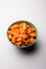 Cantaloupe / muskmelon / kharbuja cut into pieces, served in a bowl. selective focus